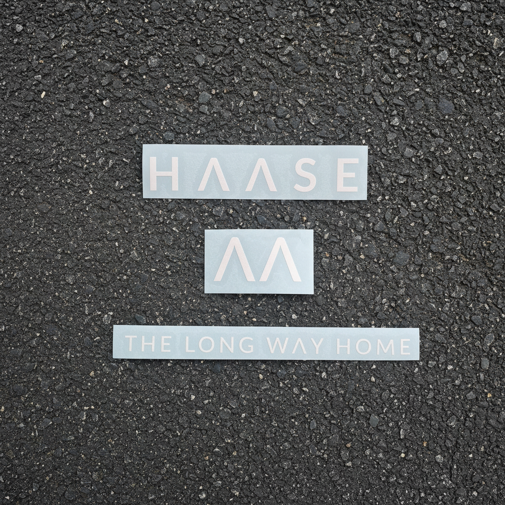 White stickers on tarseal